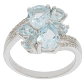 Sterling silver ring featuring pear blue aquamarine stones and moissanite accents for an elegant look.